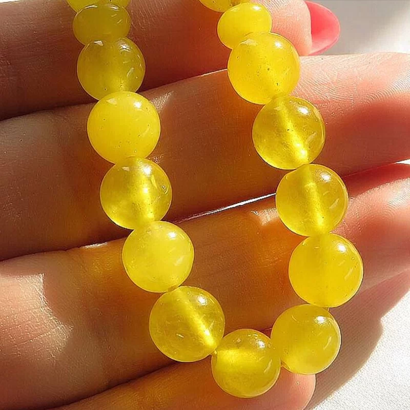 تسبیح جید زرد مدل 33 دانه حکاکی شرف الشمس کد 114298