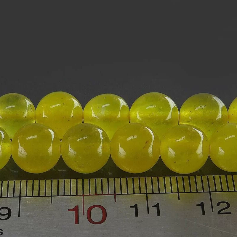 تسبیح جید زرد مدل 33 دانه حکاکی شرف الشمس کد 114298