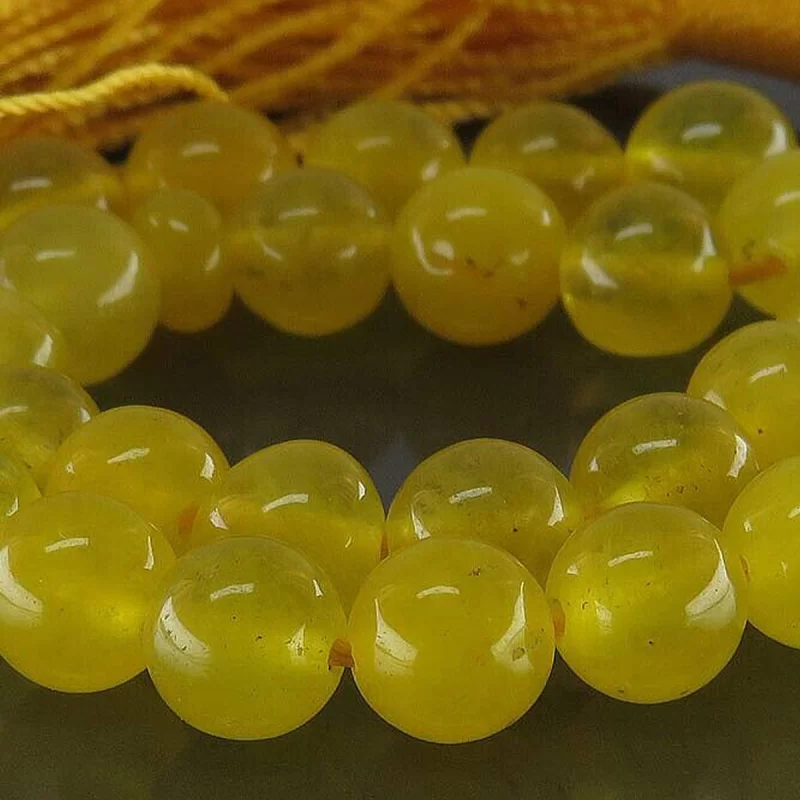 تسبیح جید زرد مدل 33 دانه حکاکی شرف الشمس کد 114298